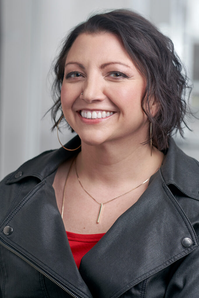 Headshot of Betty P. Rogers in a motorcycle jacket. Total bad-arse
